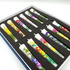 Flower Painted Warosoku Japanese Candles angled view showing hand-painted floral details on each candle in box