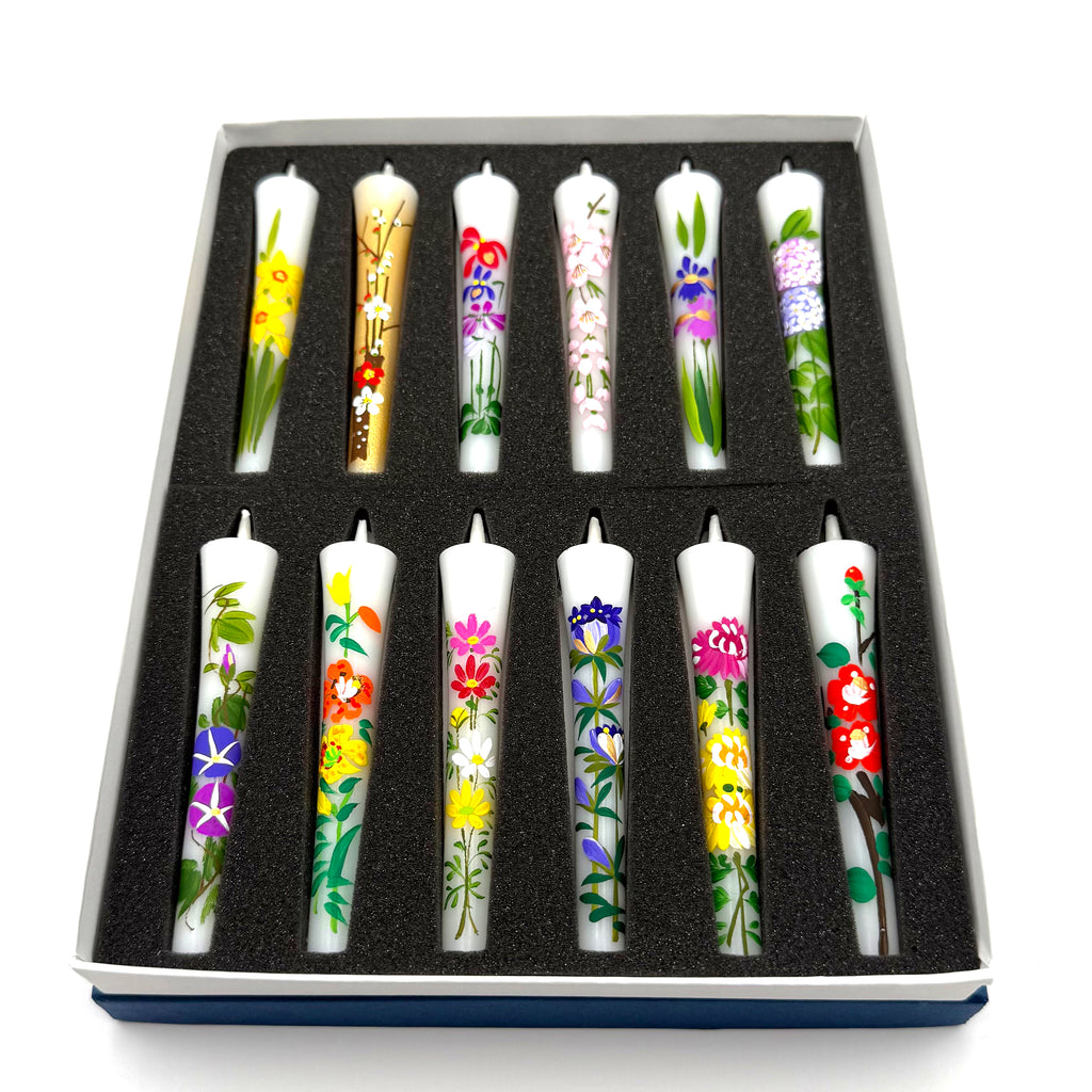Flower Painted Warosoku Japanese Candles set in dark box, top view showing 12 hand-painted floral designs