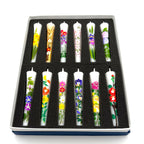 Flower Painted Warosoku Japanese Candles set in dark box, top view showing 12 hand-painted floral designs
