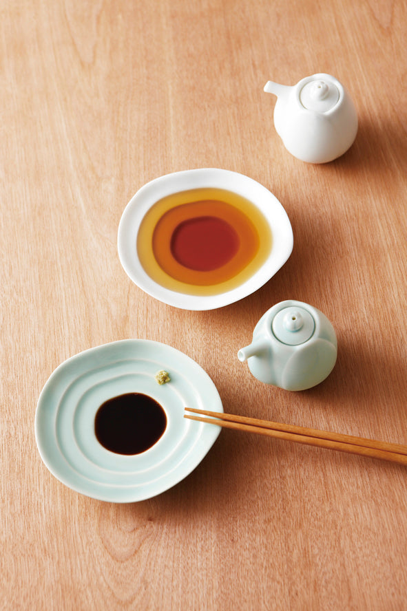 Haas 70ml Soy Sauce Pitcher lifestyle with white and bluegreen celadon dishes and soy sauce on wooden table