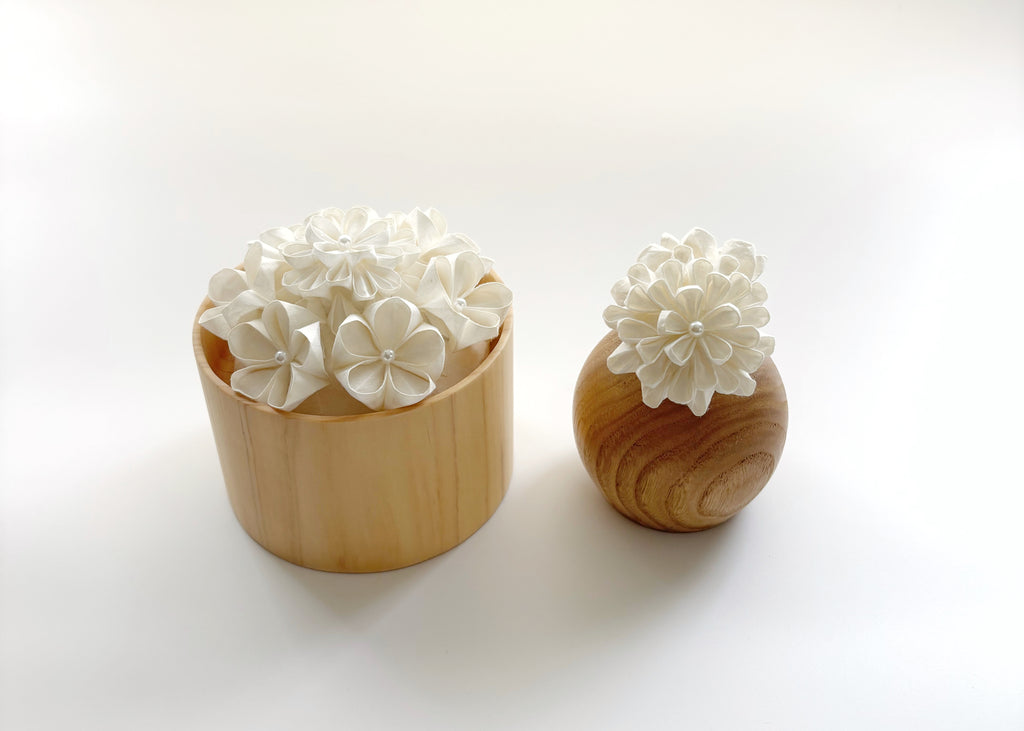 Kaminoka Paper Flower Basket aroma diffuser pair in chestnut wood tones, product view