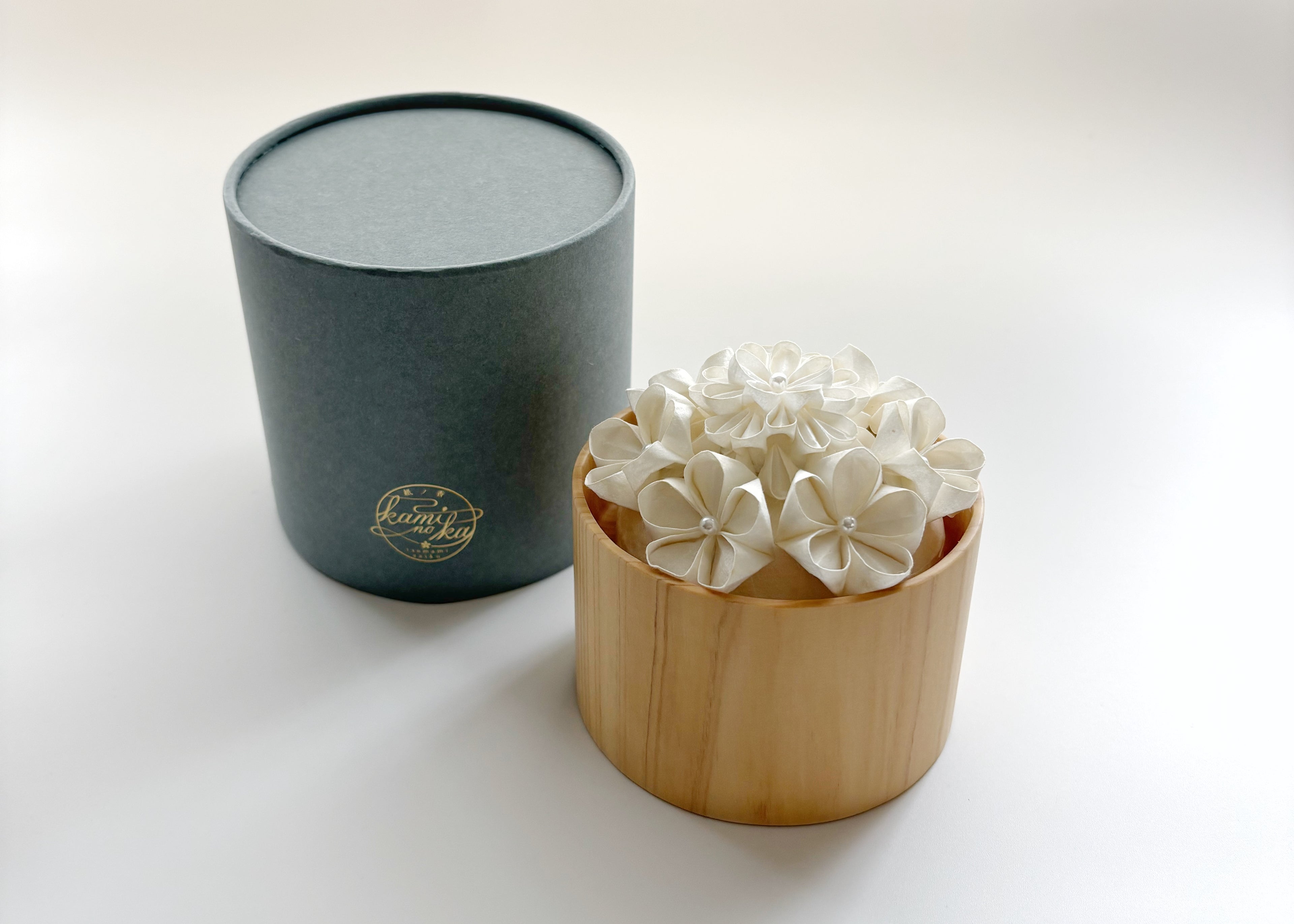 Kaminoka Paper Flower Basket aroma diffuser, hinoki cypress vessel with washi paper flowers and gray gift packaging