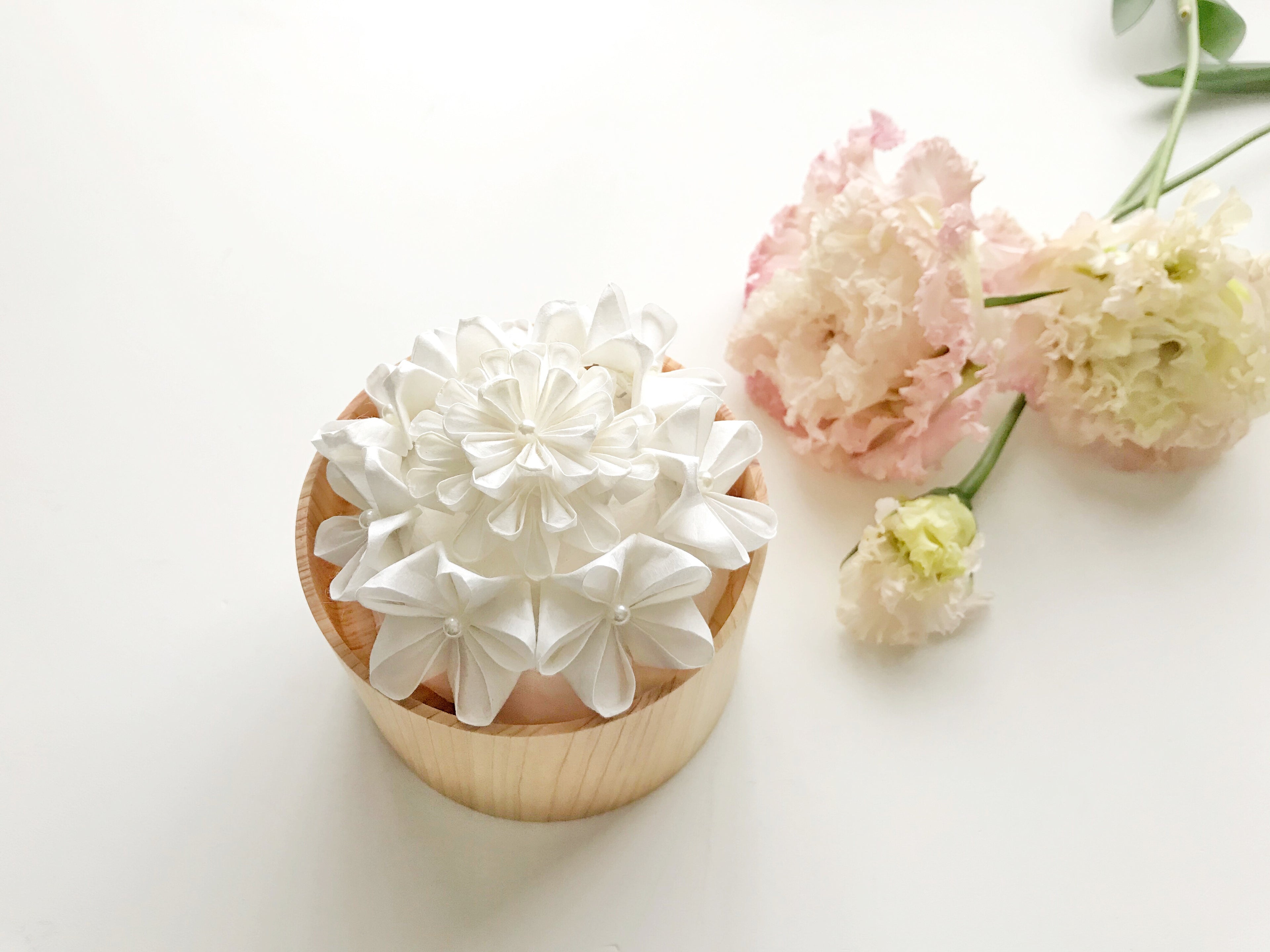 Kaminoka Paper Flower Basket aroma diffuser styled with fresh pink and white flowers