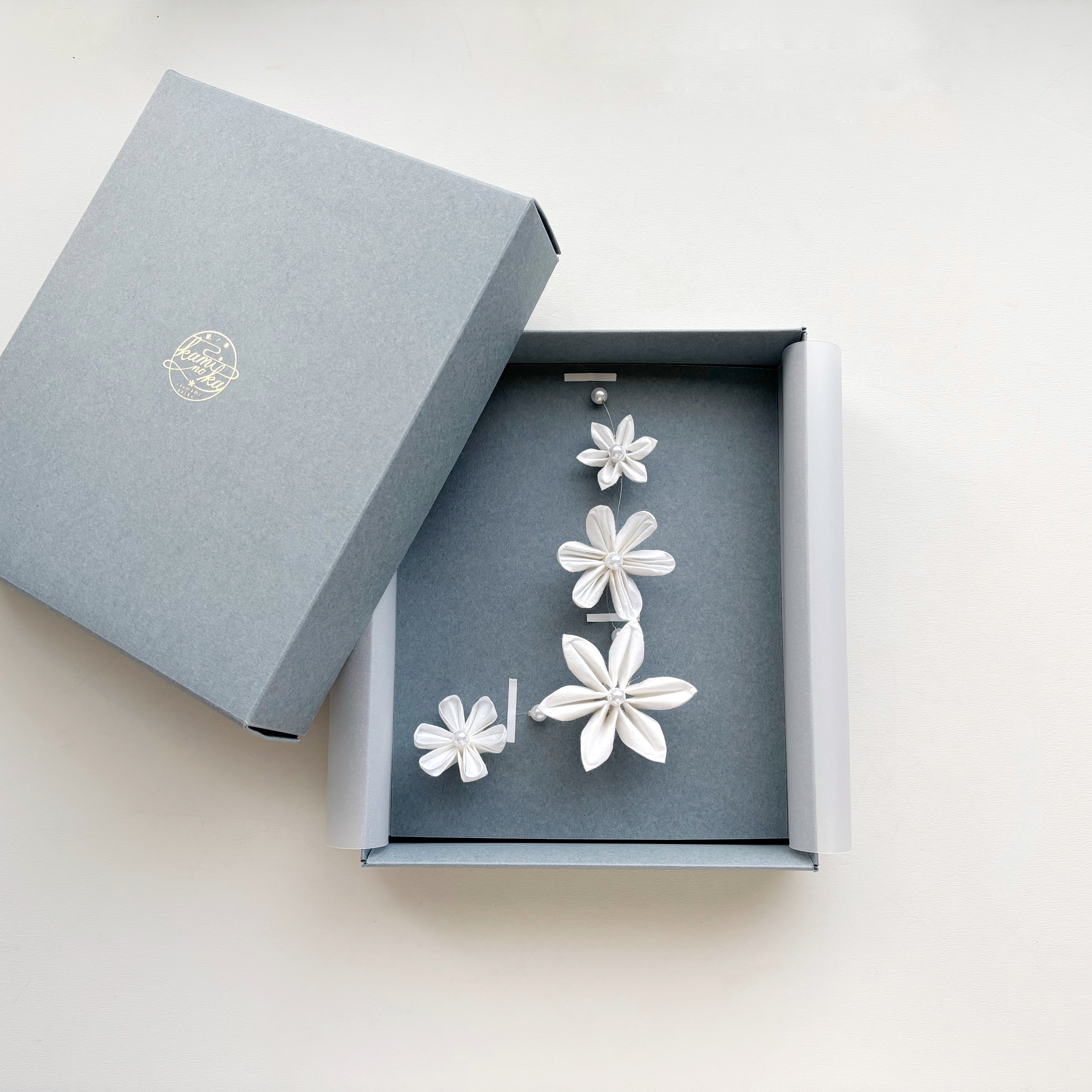 Kaminoka Type A washi paper flower mobile in a gray gift box, package view