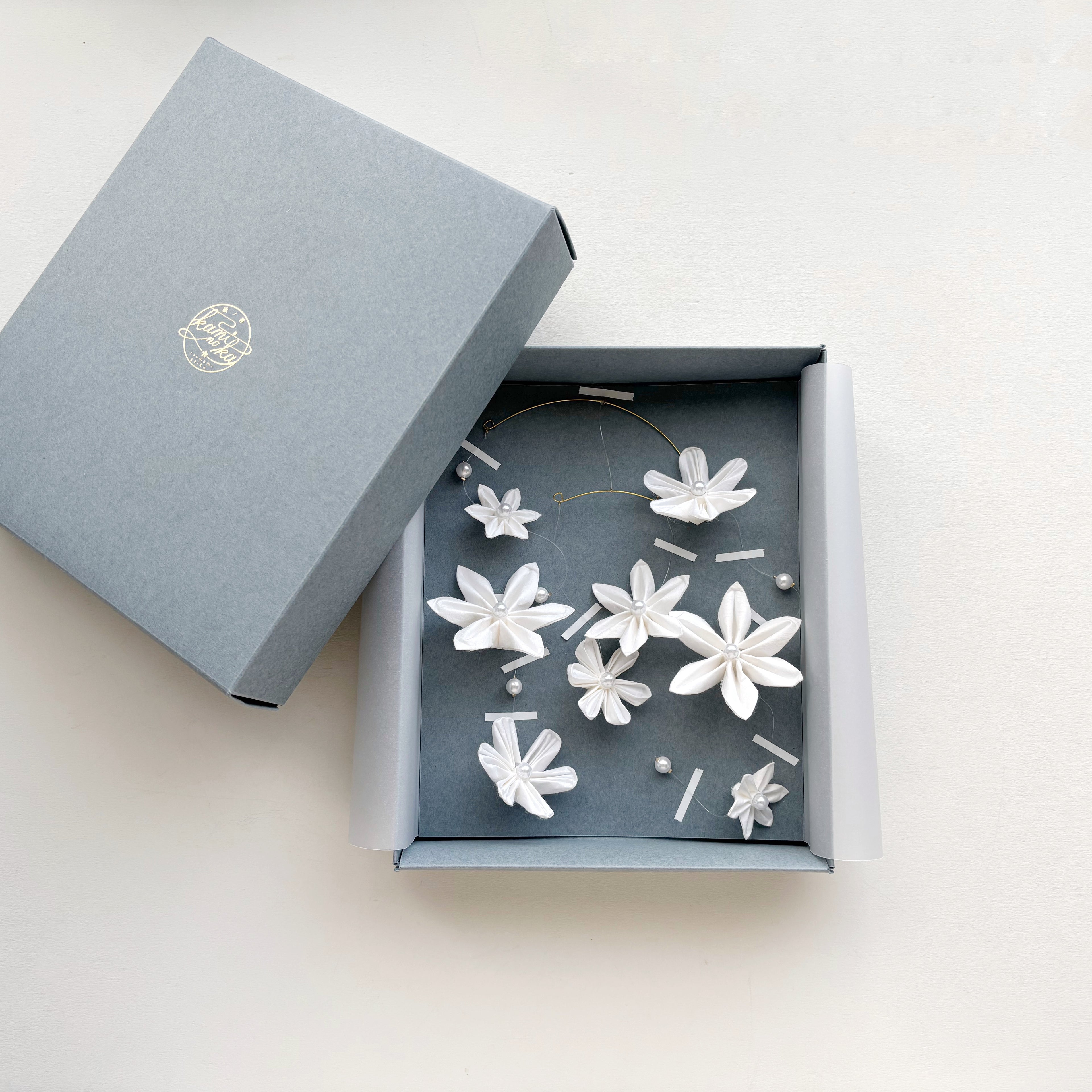 Kaminoka washi paper flower mobile in a gray gift box, package view