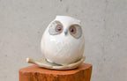 Japanese Owl Incense Stick Stand white ceramic figurine sitting on wood stump with leaf tray, lifestyle