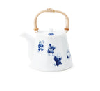 Shichifuku Dobin Teapot in white porcelain with blue Seven Lucky Gods illustrations and bamboo handle, side view