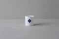 Washokki Yunomi teacup in white porcelain with blue Sometsuke swirl pattern, side view
