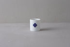 Washokki Yunomi teacup in white porcelain with blue Sometsuke swirl pattern, side view