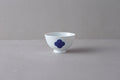 Washokki rice bowl in white porcelain with blue Sometsuke swirl pattern, side view