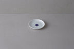 Washokki small plate in white porcelain with blue Sometsuke swirl pattern in center