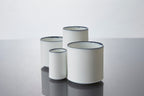 White Line Mini Cup 45ml in Reactive Cobalt Blue, set of four cups with cobalt rim variations on reflective surface