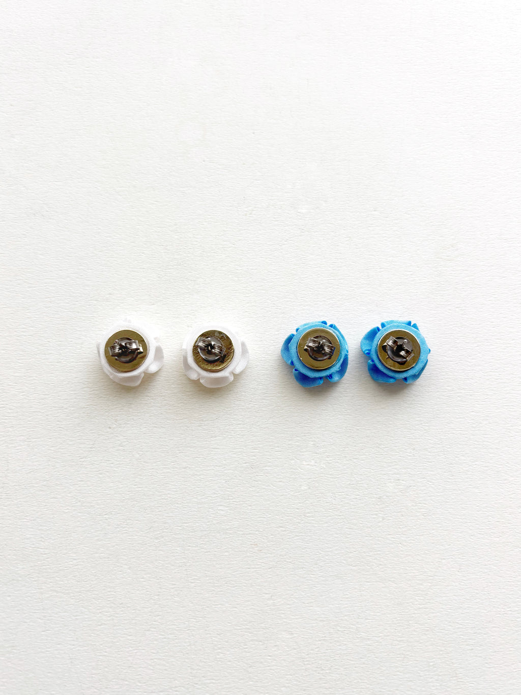 Four toy eyes with different colored irises on a white background