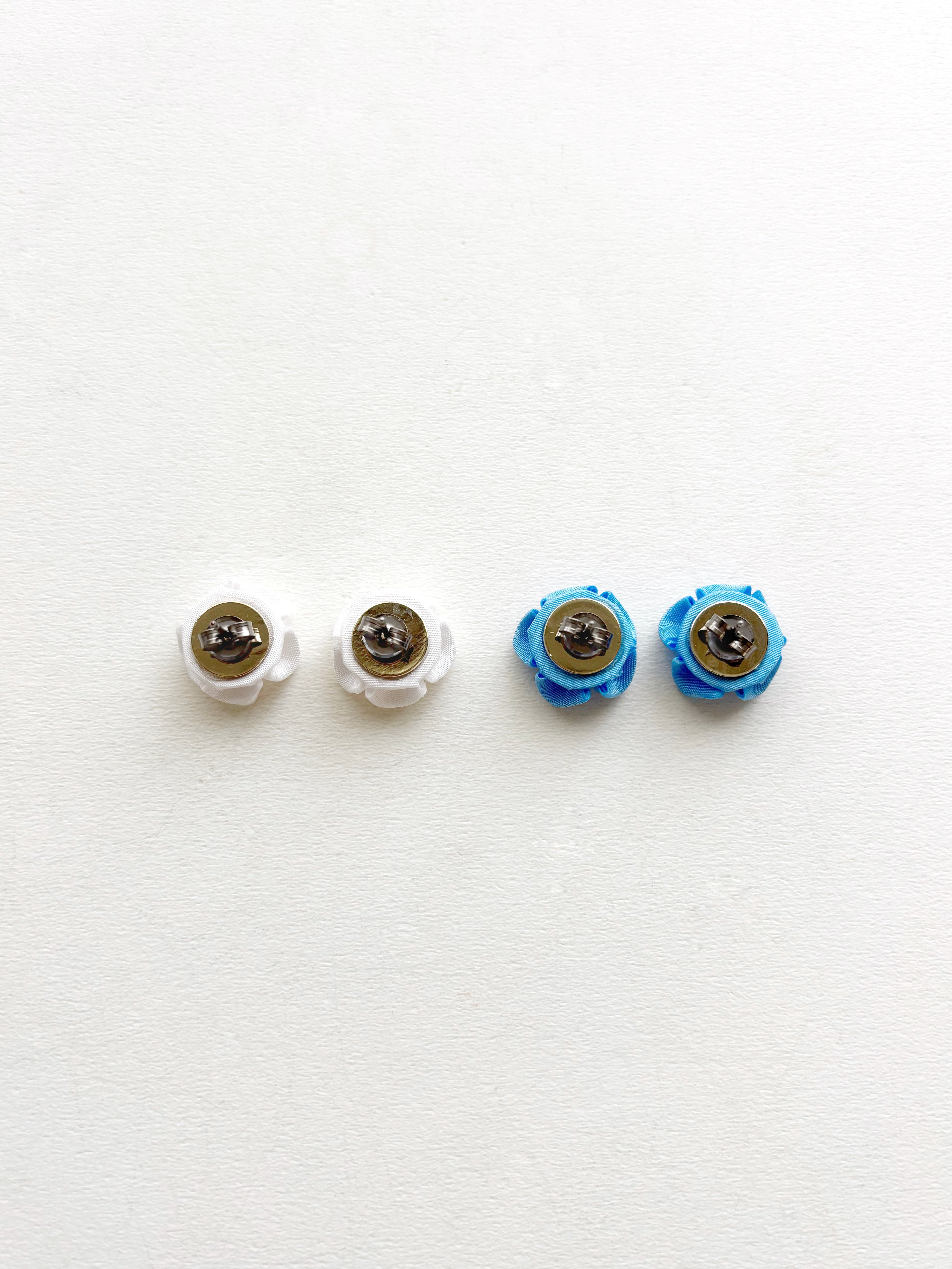 Four toy eyes with different colored irises on a white background
