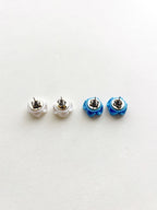 Pair of earrings with white and blue color options on a light gray background
