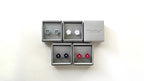 Set of earrings in a display box on a white background