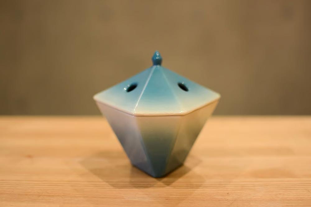 En-Koro Japanese incense burner on a wooden table, lifestyle view