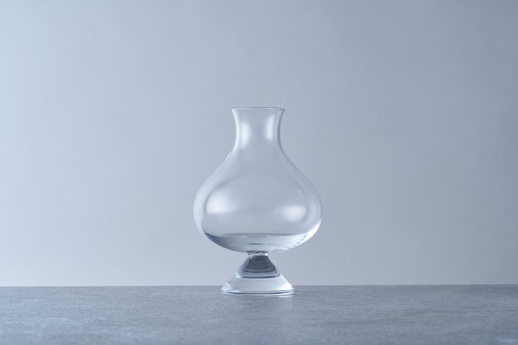 Clear thistle-style small size beer glass with a pedestal base and flared rim. Specialty glassware designed to enhance aromatics for Belgian ales, stouts, and craft beers.