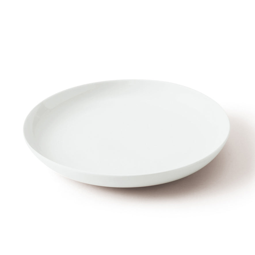 Single **plain white Japanese porcelain plate** with a smooth, shallow bowl shape, on a white background.