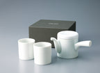 Complete Japanese tea set featuring one white porcelain teapot and two matching Yunomi cups, displayed with the dark gray gift box.