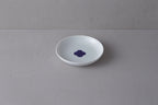 Medium white **Japanese porcelain plate** with a deep well, featuring a **blue and white Sometsuke swirl design** in the center.