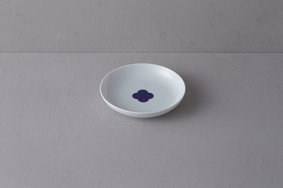 Medium white **Japanese porcelain plate** with a deep well, featuring a **blue and white Sometsuke swirl design** in the center.
