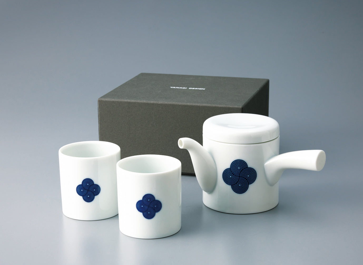 Japanese **porcelain tea set** with a **blue and white Sometsuke swirl pattern**, featuring one teapot and two Yunomi cups, displayed with the gift box.